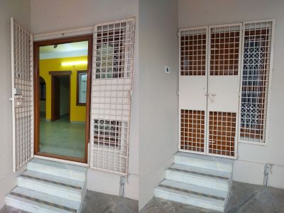 front main wooden door with grill steel gate of 2bhk in arundhadhi apartment bengaluru